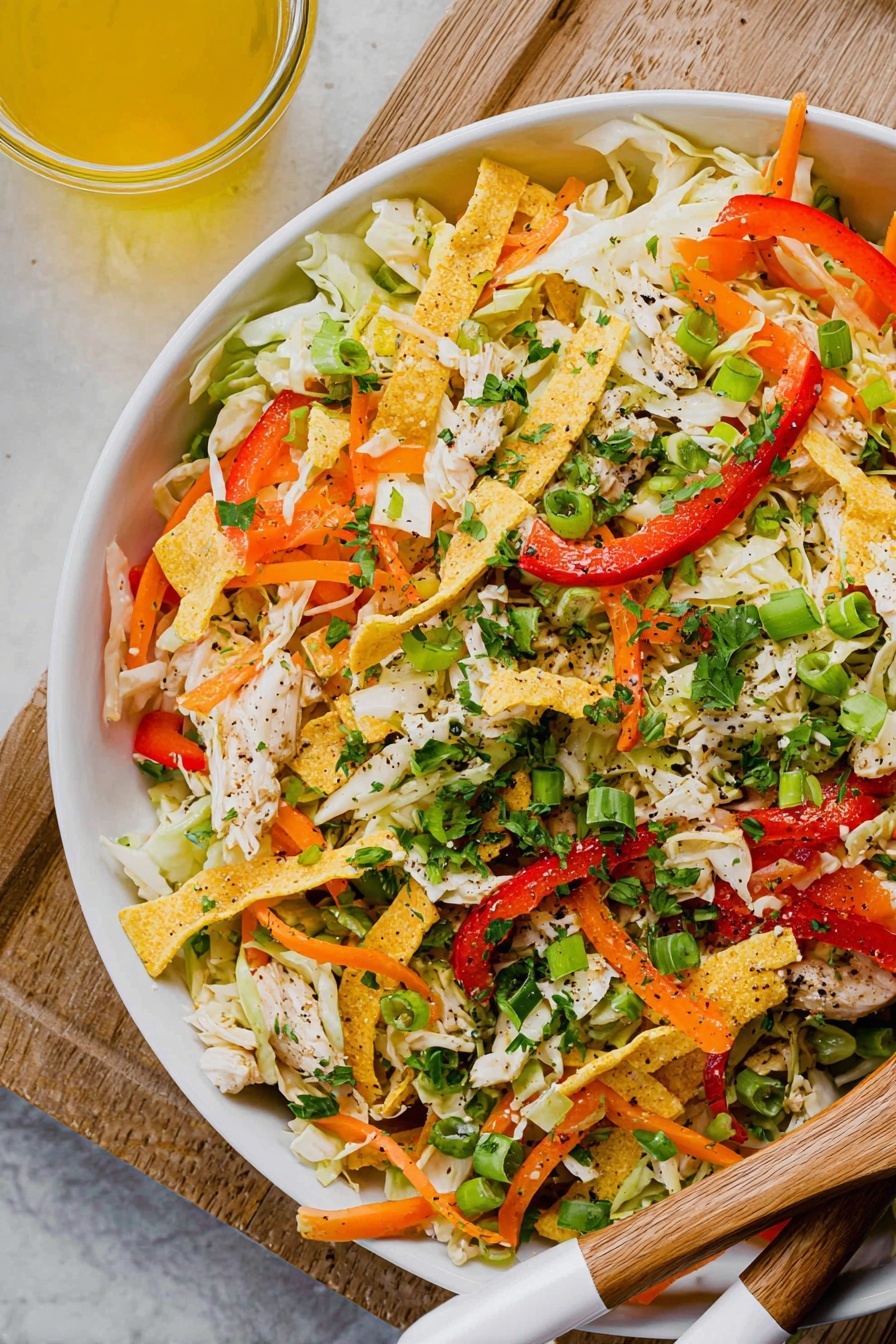 A white bowl filled with a colorful salad made of shredded white cabbage as the base layer, mixed with bright orange carrot strips and thin red bell pepper slices evenly spread throughout. On top are scattered thin strips of light golden fried tortilla, bright green chopped scallions, and fresh chopped cilantro leaves adding a fresh green touch. The textures mix soft cabbage with crunchy vegetables and crispy tortilla strips, creating a vibrant, fresh look. The bowl rests on a white marbled surface with a wooden spoon and fork white handles on the right side, along with a small white round dish with chopped cilantro in the background and a small wooden bowl with salt and a wooden spoon at the top left. Photo taken with an iphone --ar 2:3 --v 7