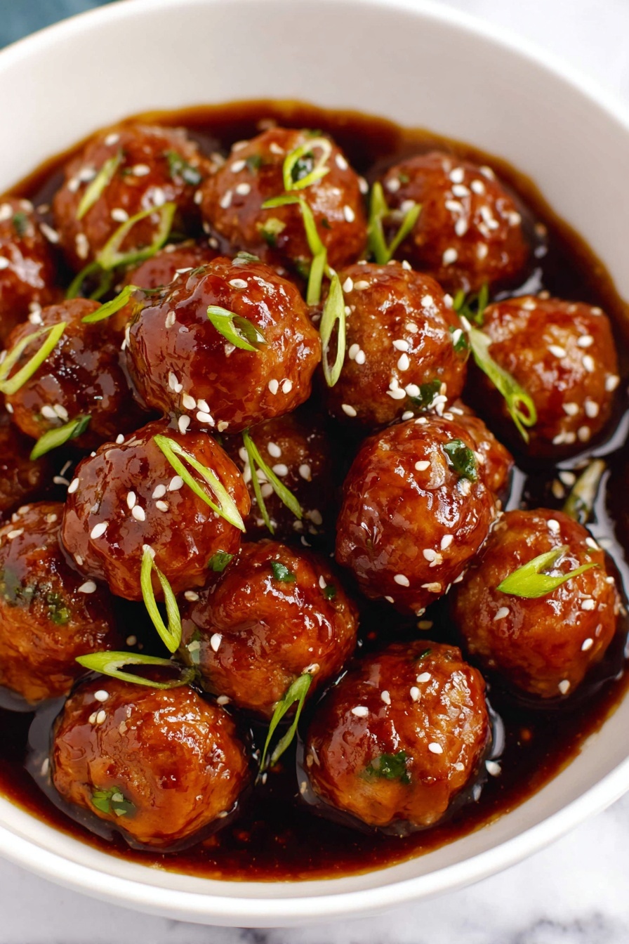The image shows a white bowl filled with many small, round meatballs covered in a shiny, dark brown sauce. Each meatball has a smooth but slightly bumpy texture with small green bits inside, and they are topped with sprinkled white sesame seeds and thin green onion slices. The sauce pools at the bottom of the bowl, giving a glossy look to the dish. The bowl sits on a white marbled surface. photo taken with an iphone --ar 2:3 --v 7