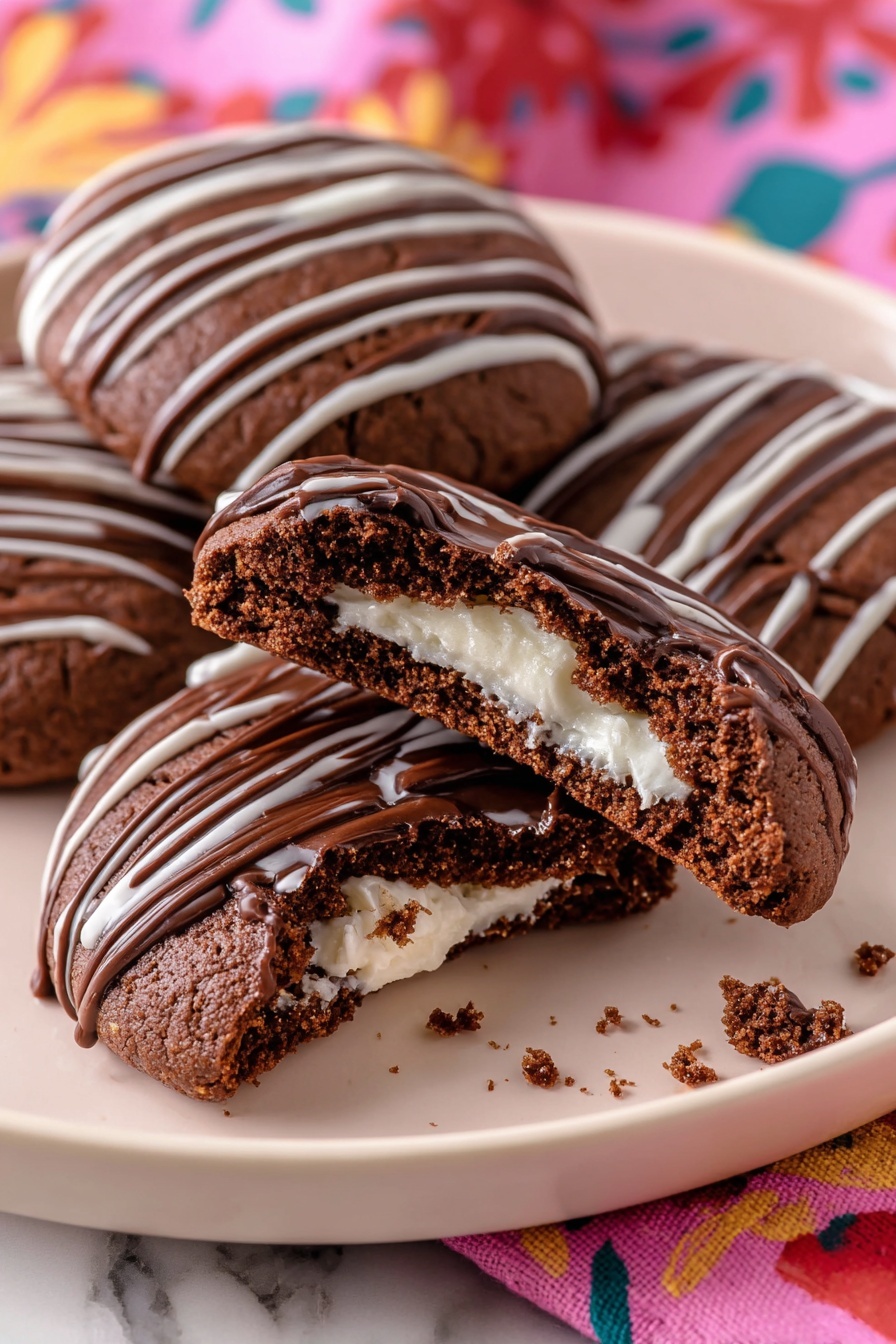A close-up of three round dark brown cookies arranged on a white plate, each topped with thin diagonal lines of glossy milk chocolate drizzle. The front cookie is bitten, revealing one inner layer of creamy white filling with a smooth texture inside the thick, dark cookie base. Small cookie crumbs are scattered around the bitten cookie on the plate. The plate sits on a colorful fabric with pink, yellow, red, and blue patterns placed on a white marbled surface. photo taken with an iphone --ar 2:3 --v 7