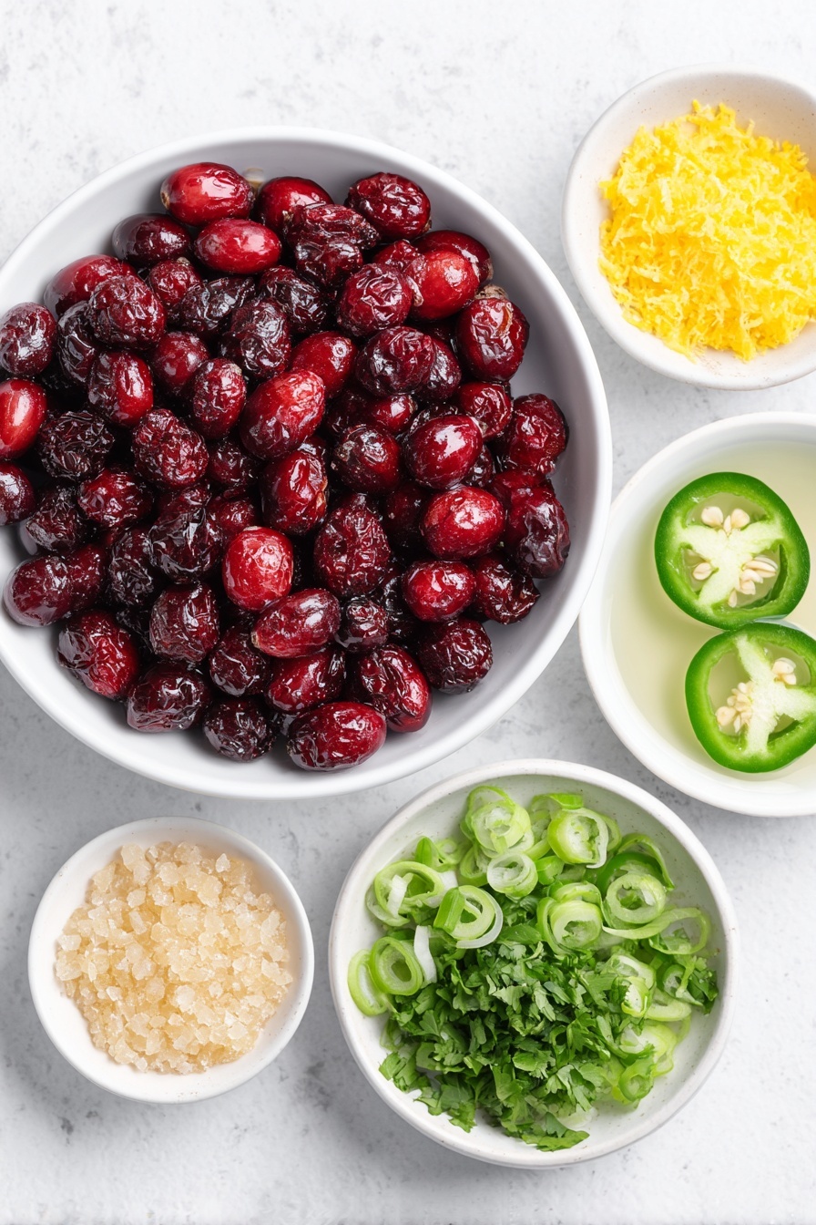 Flat lay of fresh whole cranberries scattered beside a small mound of bright orange zest, two halved green jalapeños with seeds removed, a neat pile of sliced green onions, a small bunch of chopped fresh cilantro, a small white ceramic bowl filled with clear lime juice, a small white ceramic bowl holding raw golden sugar crystals, and a small white ceramic bowl containing fine white salt, all arranged in perfect symmetry on a clean white marble surface, soft natural light, photo taken with an iPhone, professional food photography style, fresh ingredients, white ceramic bowls, no bottles, no duplicates, no utensils, no packaging --ar 2:3 --v 7 --p m7354615311229779997
