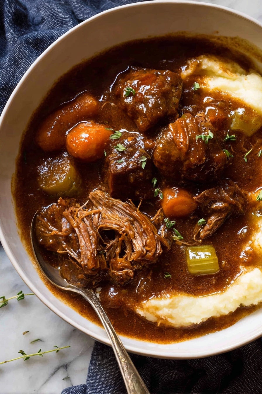 The image shows a black frying pan on a stove with several pieces of raw red meat cooking in bubbling oil. The meat pieces are cut into small, irregular cubes with visible white fat lines. The surface beneath the pan is a white marbled texture. The pan handle is partially visible on the right side. Photo taken with an iphone --ar 2:3 --v 7