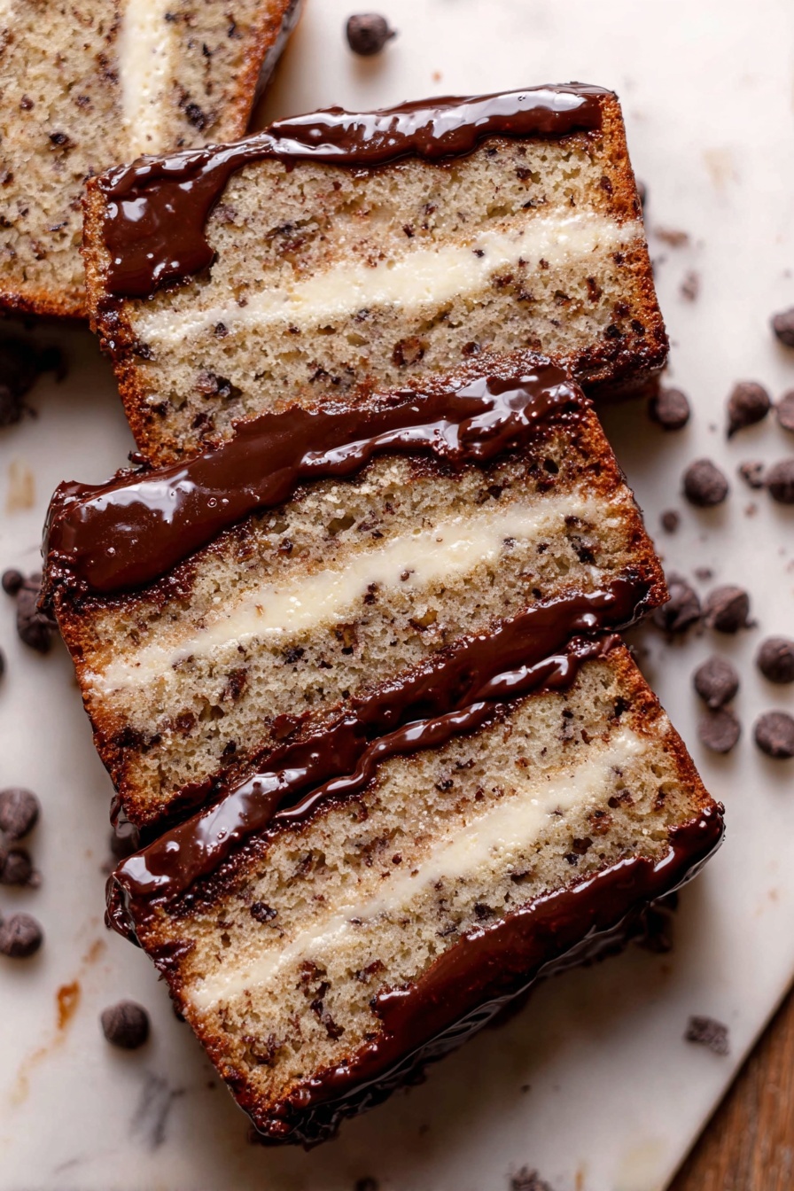 A close-up view of four slices of a two-layer cake placed side by side on a white marbled surface. Each slice has a thick light brown cake layer with visible dark specks and bits, alternating with creamy white filling layers in the middle. The top of each slice is coated with a shiny dark chocolate glaze that slightly drips down the sides. Scattered dark chocolate chips surround the cake slices, adding texture and contrast to the scene. Photo taken with an iphone --ar 2:3 --v 7