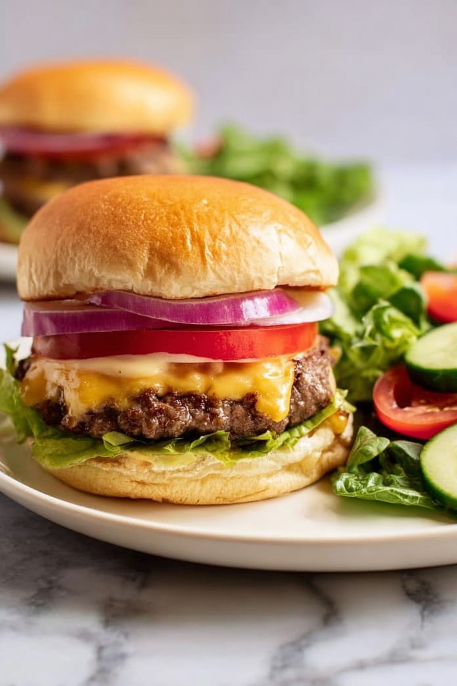 A close-up of a double cheeseburger on a white plate with a side salad on a white marbled surface. The burger has a soft golden bun top with layers beneath it: two slices of red onion, a bright red tomato slice, two melted yellow cheese-covered beef patties with a slightly browned texture, fresh green lettuce, and a light spread of sauce on the bottom bun. The side salad includes leafy green lettuce, cucumber slices, and tomato pieces. Photo taken with an iphone --ar 2:3 --v 7