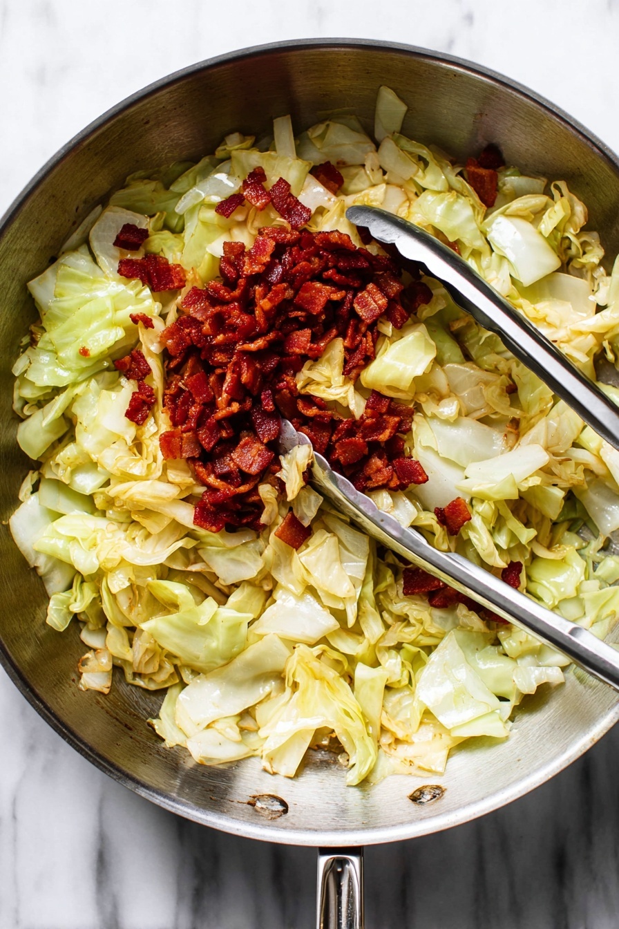A close-up image shows a spoon lifting cooked cabbage mixed with browned bacon pieces from a pan. The cabbage layers are light green and slightly translucent with some browned edges, giving a soft texture look. The crispy bacon pieces are dark red-brown and scattered evenly among the cabbage. The background has a blurred view of more cabbage and bacon in the pan, all on a white marbled surface. The photo taken with an iphone --ar 2:3 --v 7